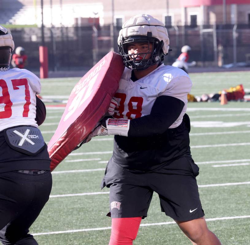 UNLV football walk-on defensive lineman Tatuo Martinson (98) works out during practice at Rebel ...