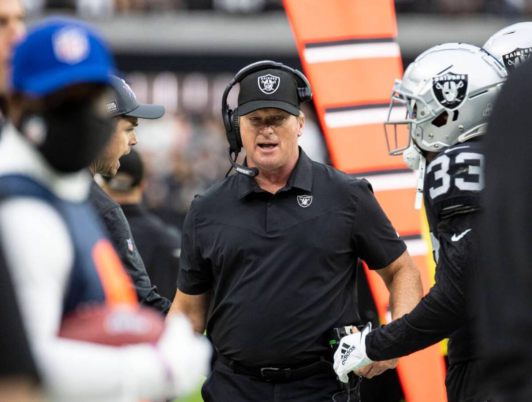 Raiders head coach Jon Gruden walks on the side line during the first half of an NFL football g ...