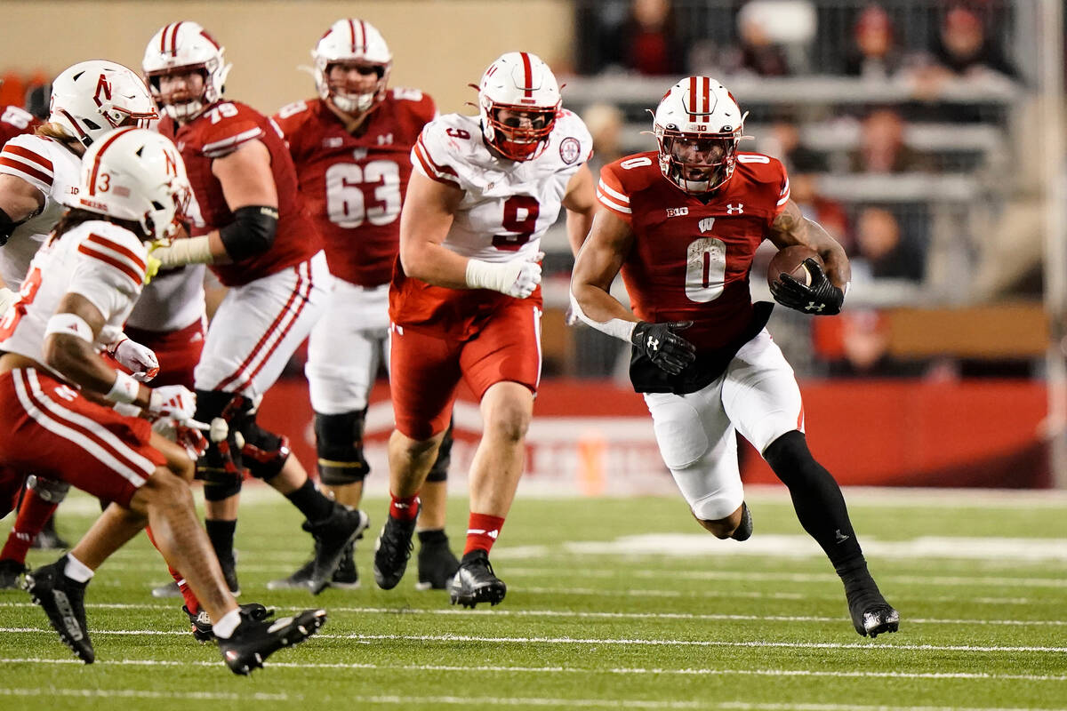 Wisconsin's Braelon Allen (0) runs during the second half of an NCAA college football game agai ...