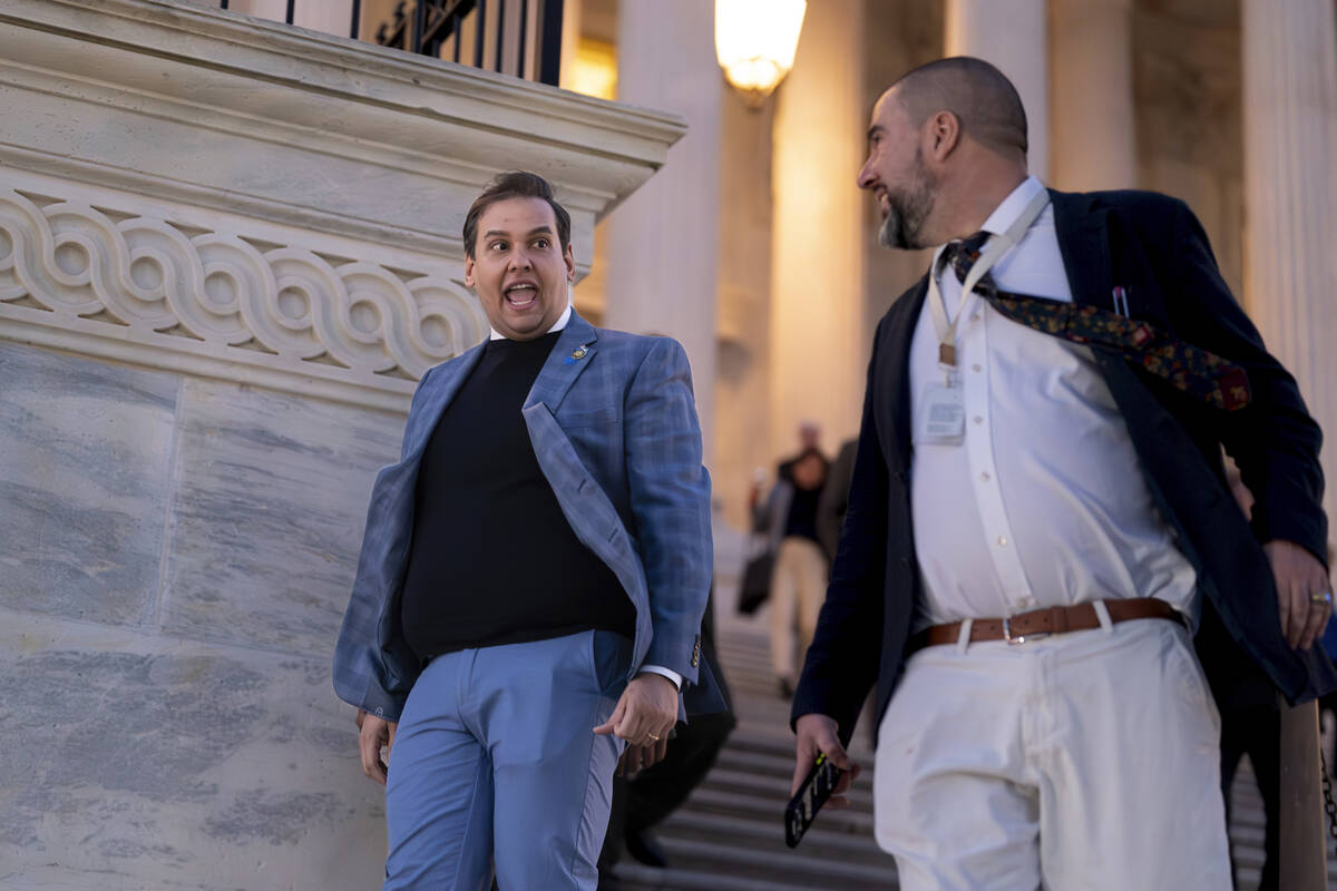 Rep. George Santos, R-N.Y., departs the Capitol in Washington, Thursday evening, Nov. 30, 2023. ...