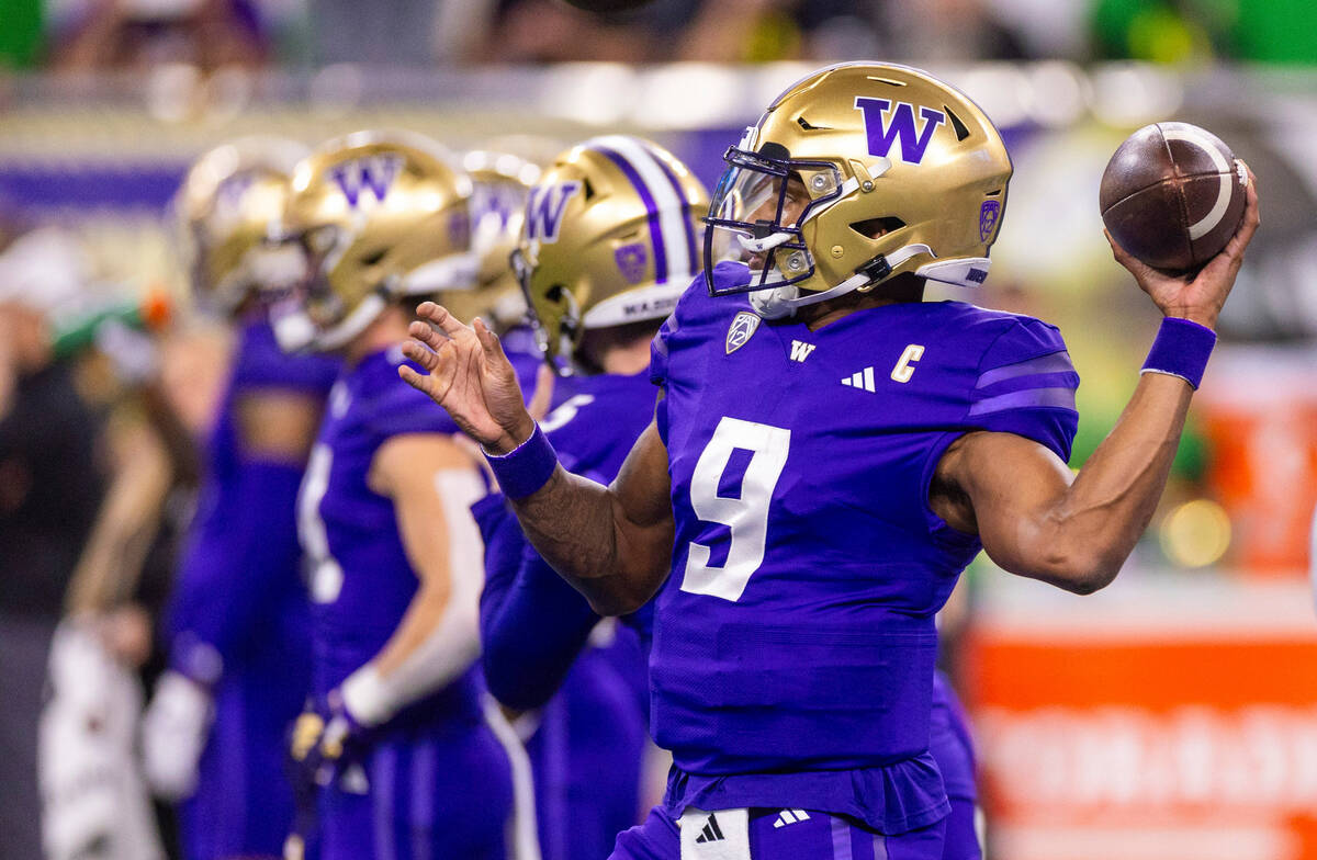 Washington Huskies quarterback Michael Penix Jr. (9) tosses a pass during warm ups before the f ...