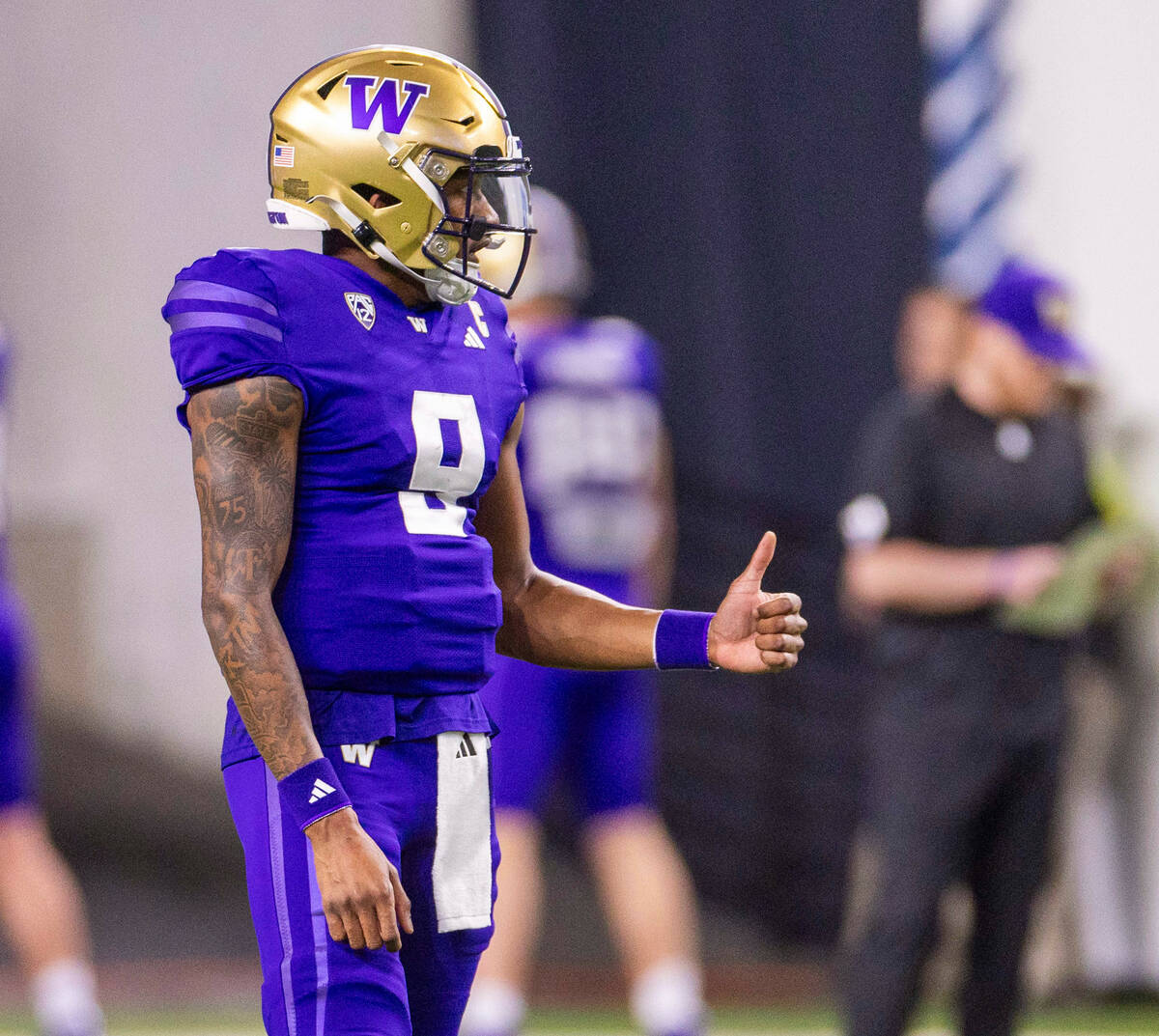 Washington Huskies quarterback Michael Penix Jr. (9) gives a thumbs up during warm ups before t ...