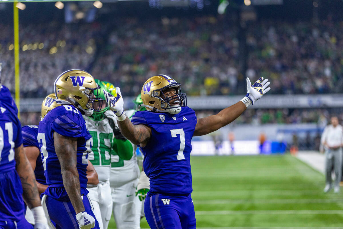 Washington Huskies running back Dillon Johnson (7) celebrates a touchdown over the Oregon Ducks ...