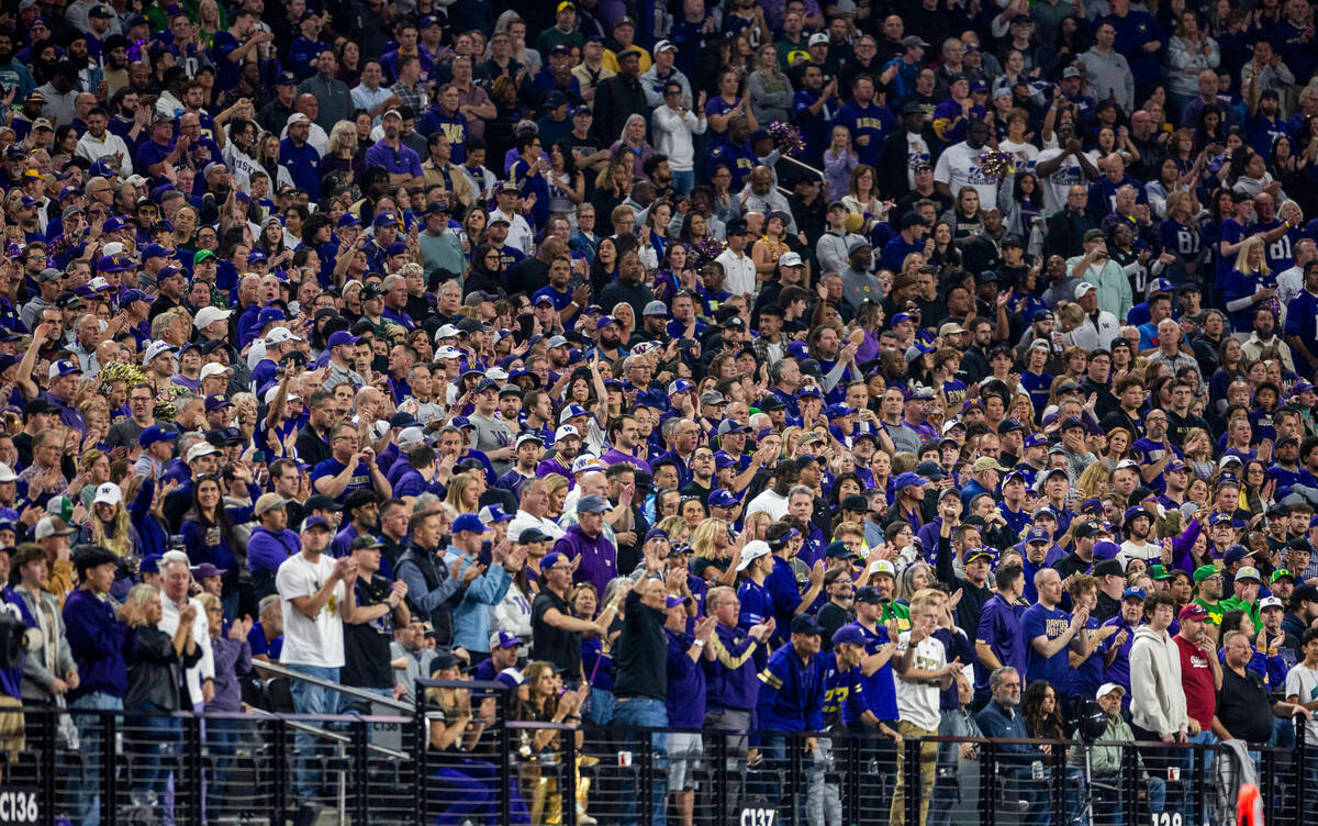 Washington Huskies fans cheer on their team against the Oregon Ducks during the first half of t ...