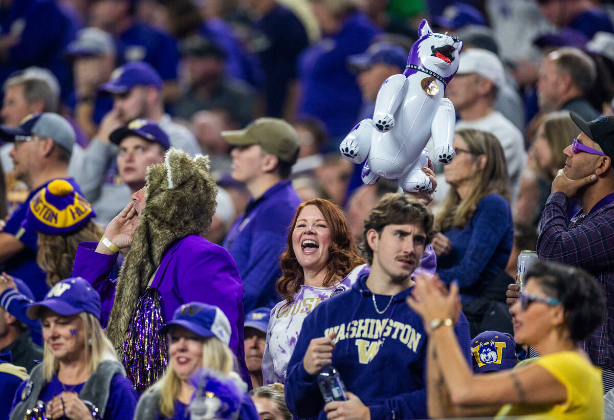 Washington Huskies fans cheer on their team against the Oregon Ducks during the first half of t ...