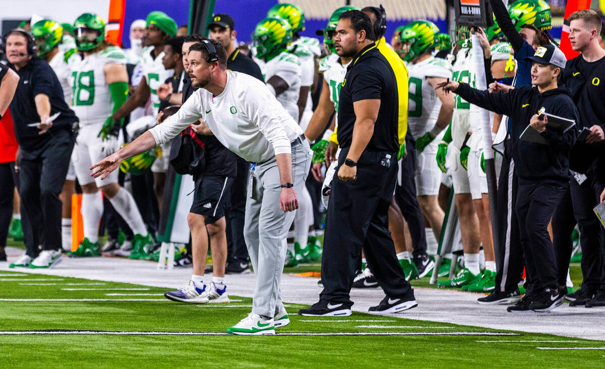 Oregon Ducks head coach Dan Lanning signals a play against the Washington Huskies during the se ...