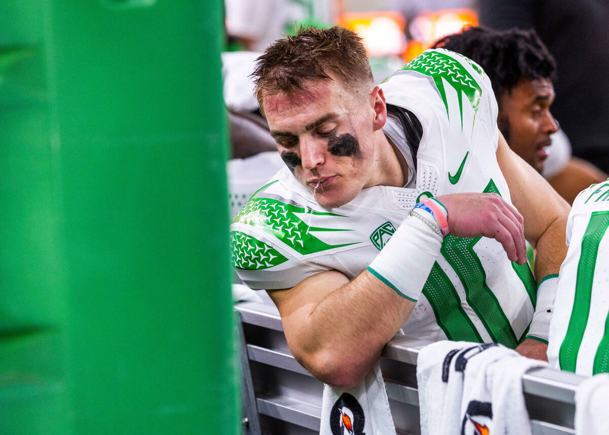 Oregon Ducks quarterback Bo Nix (10) spits on the bench against the Washington Huskies during t ...