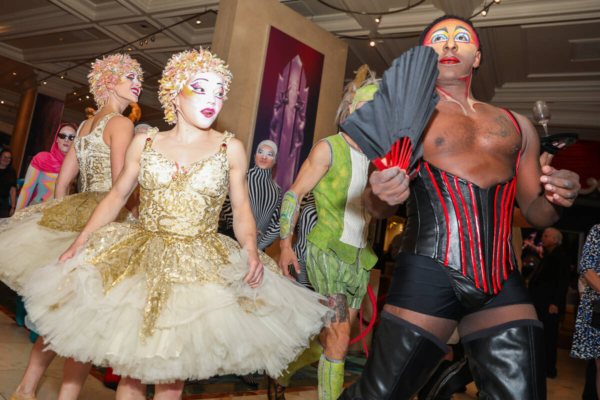 Cirque du Soleil performers walk through the Bellagio as part of the “O” annivers ...