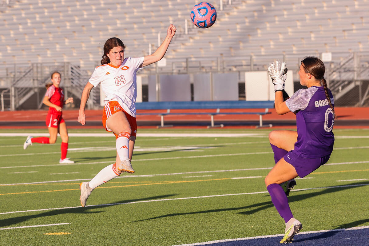 Bishop Gorman’s Hunter Borgel (24) takes a shot against Coronado’s Megan Kingman ...