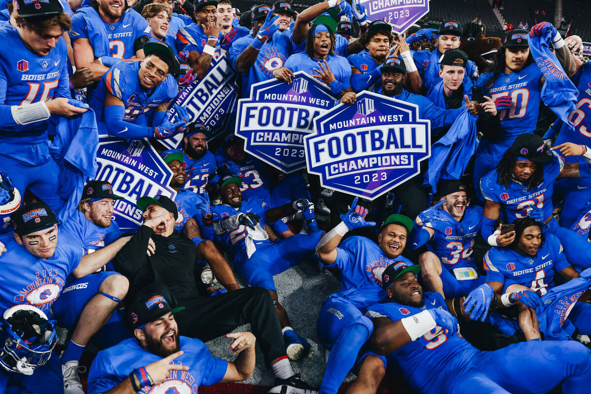 Boise State players celebrate winning the Mountain West championship game at Allegiant Stadium ...