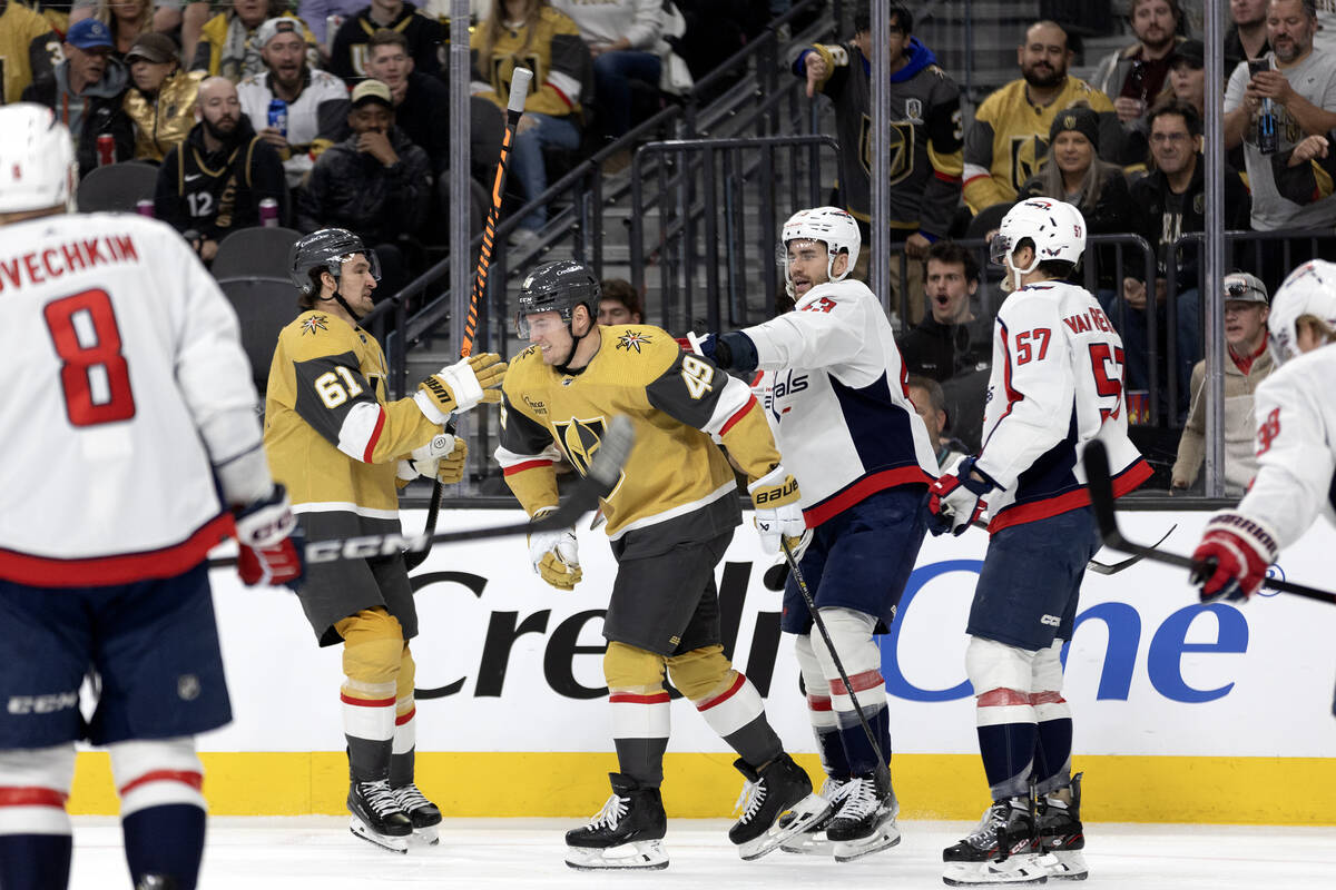 Capitals right wing Tom Wilson (43) pushes Golden Knights center Ivan Barbashev (49) during a f ...