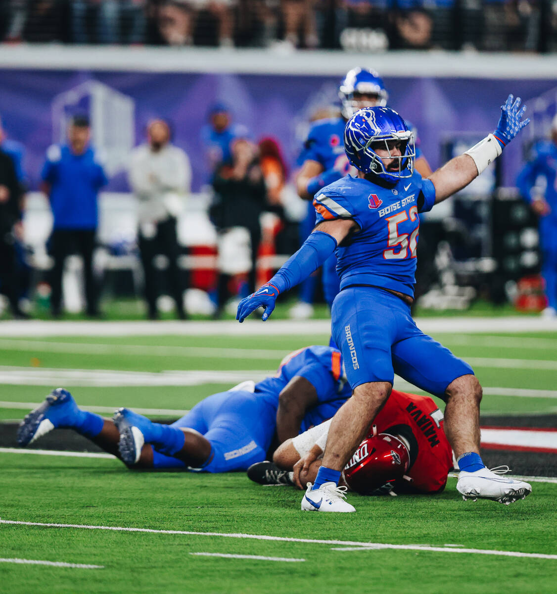 Boise State linebacker DJ Schramm (52) makes a gesture with his hands as UNLV quarterback Jayde ...