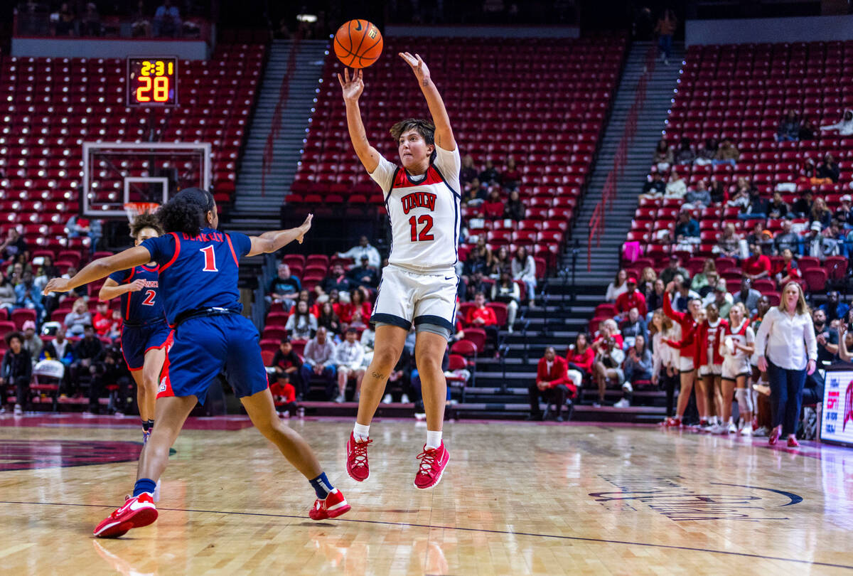 UNLV Lady Rebels guard Alyssa Durazo-Frescas (12) releases a three-point basket against Arizona ...