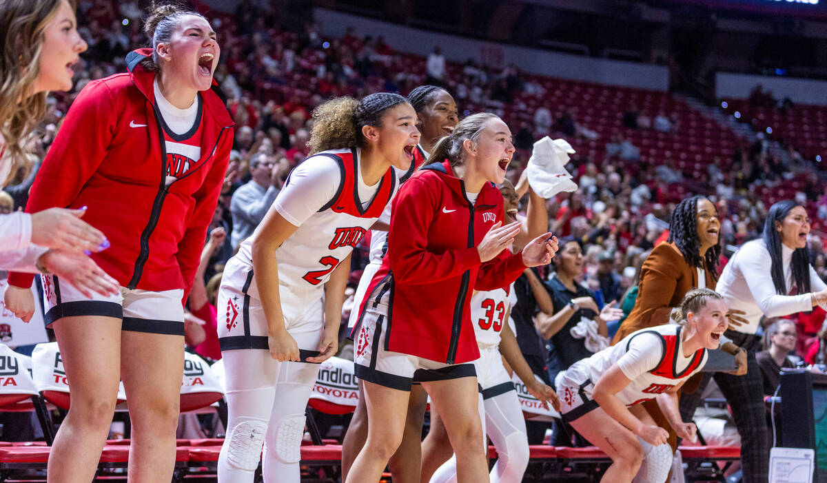 The UNLV Lady Rebels bench explodes in celebration after another big basket against the Arizona ...