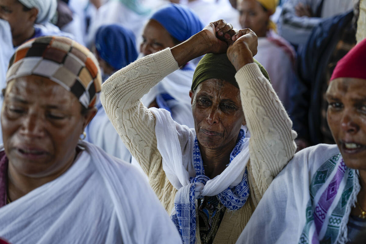 Women mourn during the funeral for Staff Sergeant Aschalwu Sama in Petah Tikva, Israel, Sunday, ...