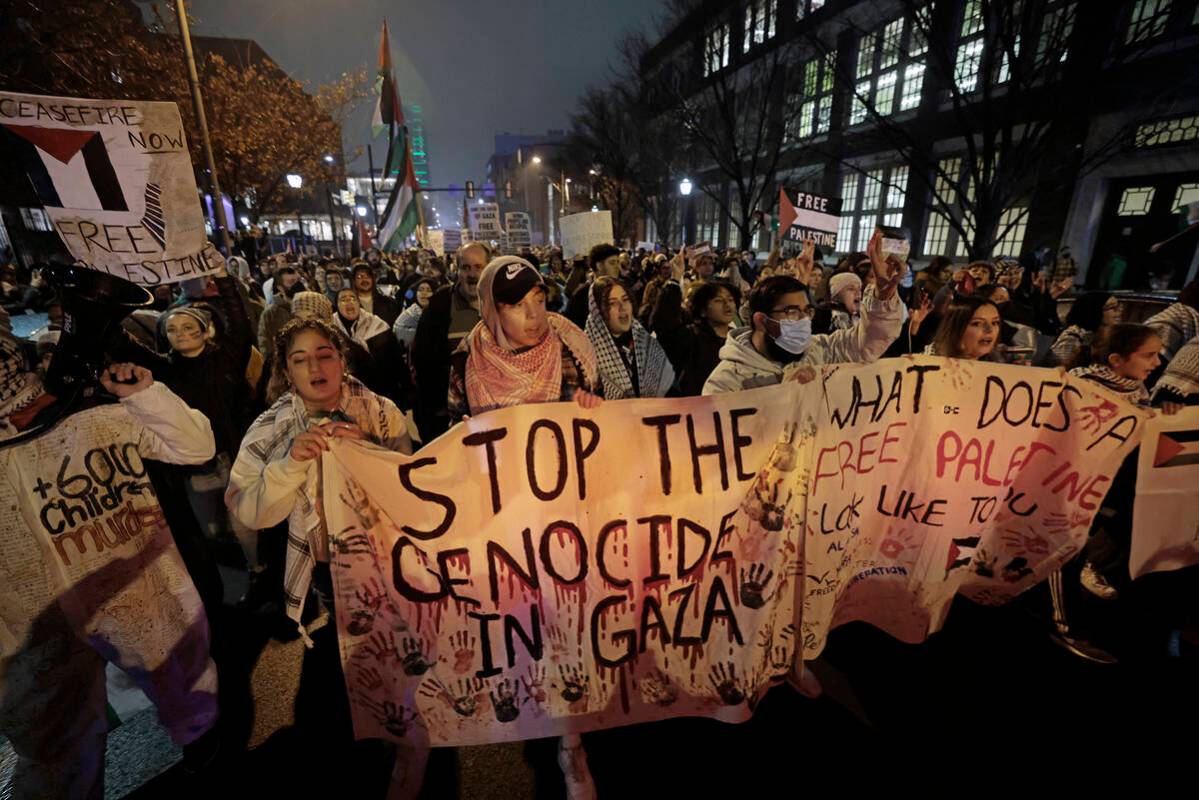 Demonstrators march west towards the UC Townhomes during a pro-Palestinians rally in Philadelph ...