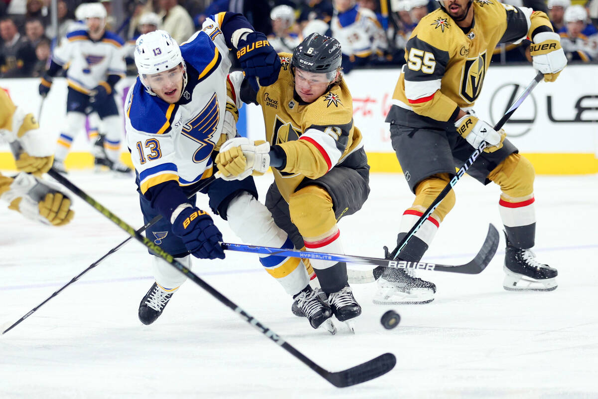 Vegas Golden Knights center Ivan Barbashev (49) collides with St. Louis Blues left wing Jake Ne ...