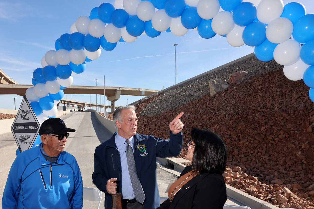 Gov. Joe Lombardo, center, visits with Curtis Anderson, left, and Deryn Pete with the Las Vegas ...