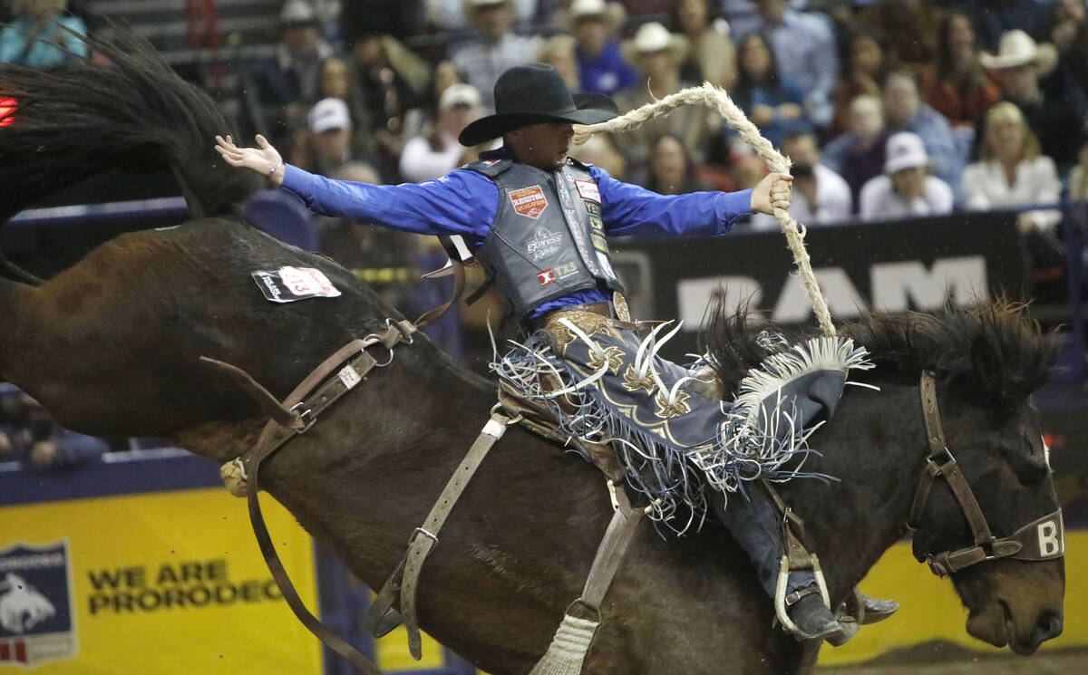 Stetson Dell Wright of Milford, Utah competes in the saddle bronc riding event during the eight ...