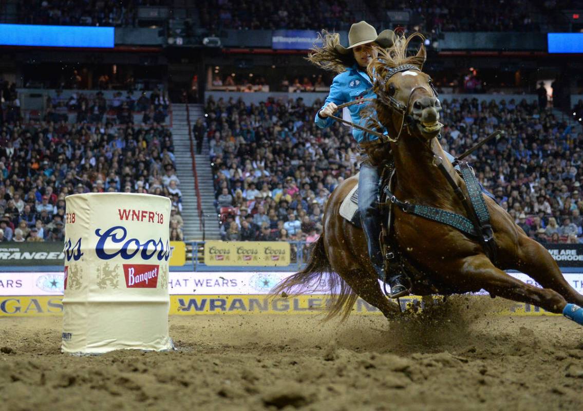 Brittany Pozzi of Tonozzi of Victoria, Texas (11) competes in Barrel Racing during the sixth go ...