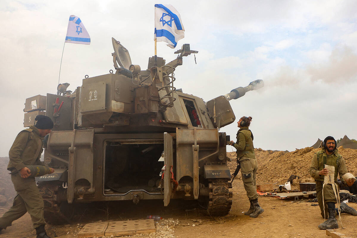 An Israeli artillery unit is pictured near the border with the Gaza Strip on Dec. 5, 2023, amid ...