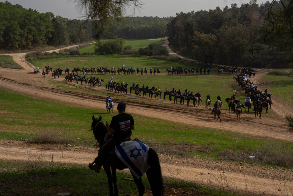 Family and supporters of Israeli hostages held by Hamas in Gaza gather for a horse ride calling ...