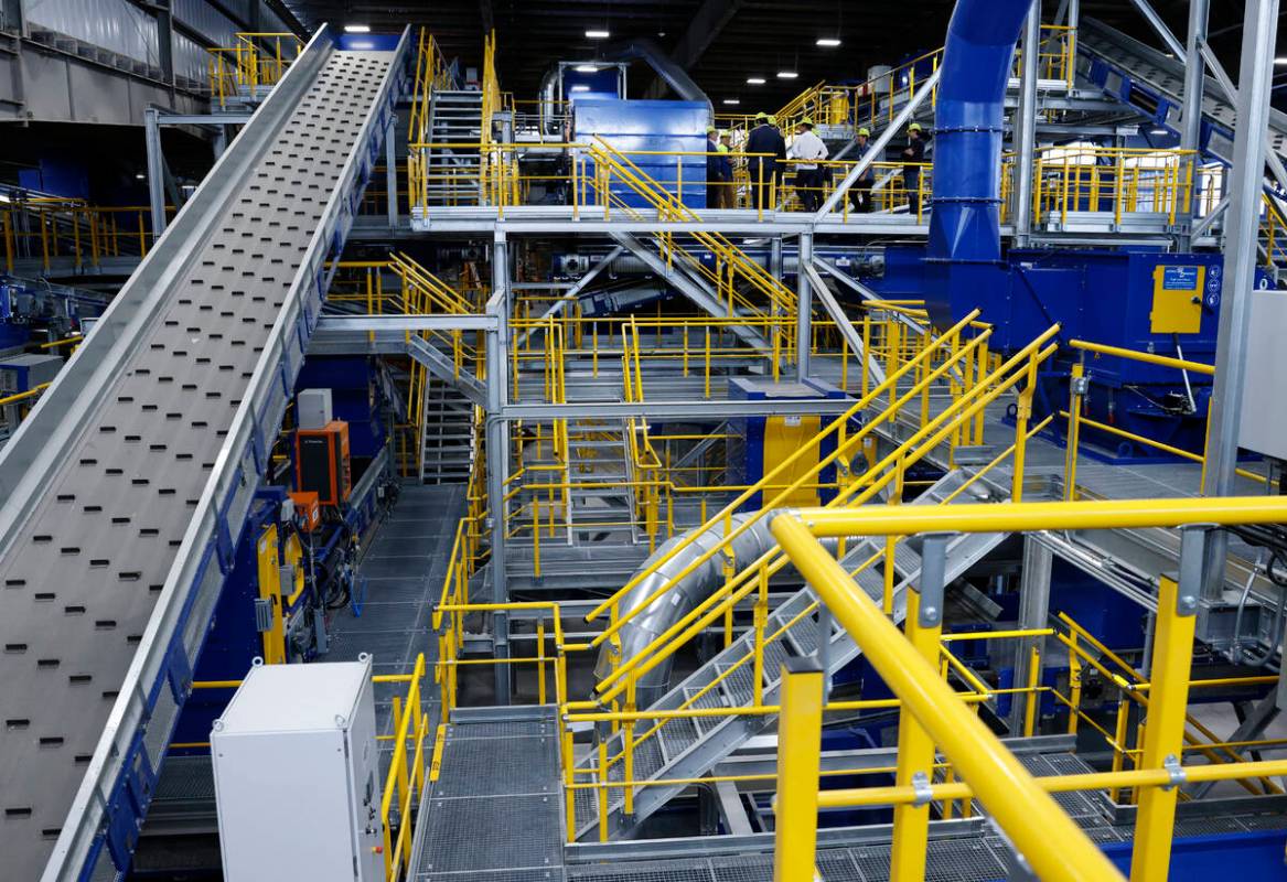 Guests tour the Republic Services Polymer Center, a recycling center, after the ribbon-cutting ...