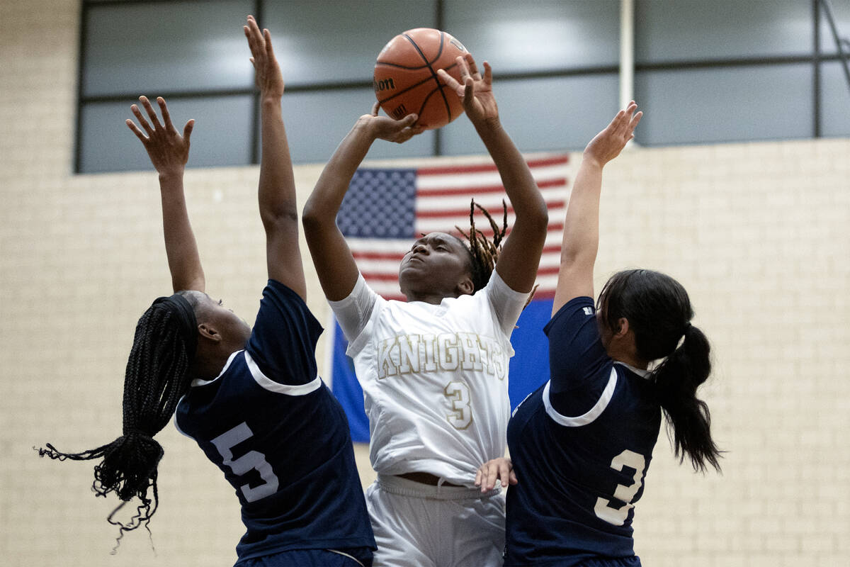 Democracy Prep’s Bray’ana Miles (3) shoots against Shadow Ridge’s Zh&#x201 ...