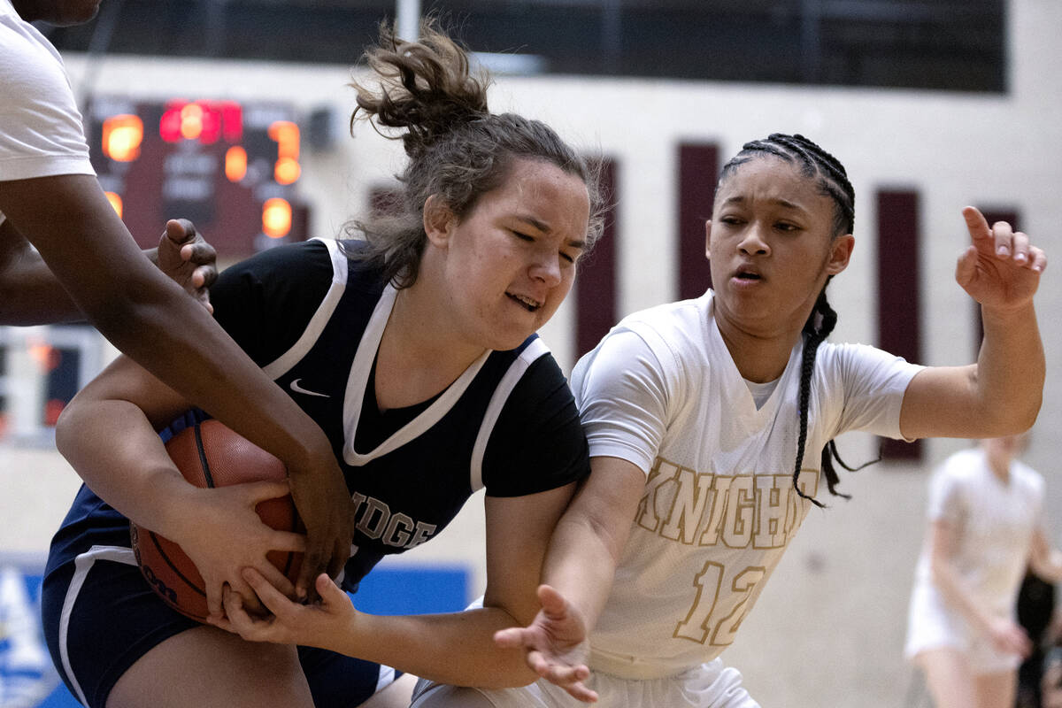 Shadow Ridge’s Lily-Renee Roopchand, left, struggles for the ball with Democracy Prep&#x ...