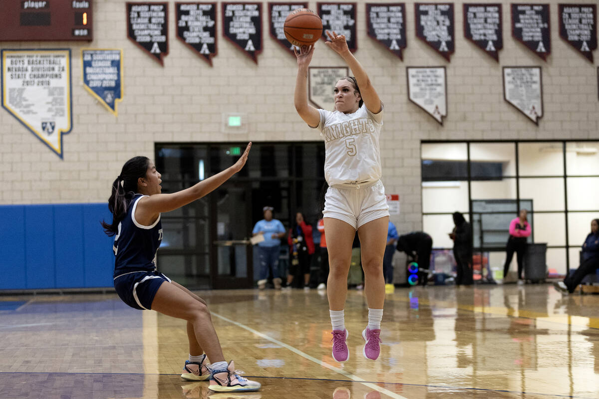 Democracy Prep’s Zayla Ellerbe (5) shoots against Shadow Ridge’s Jasmine Mata (2) ...