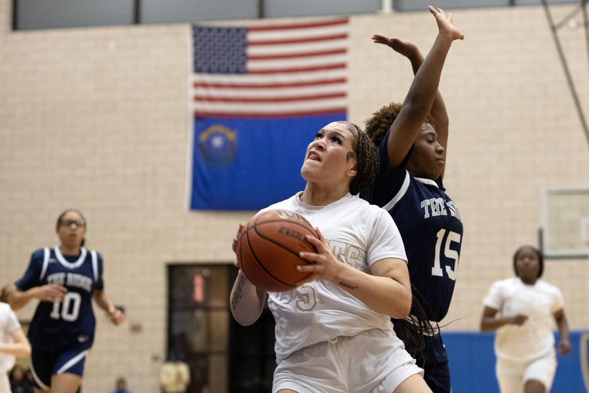 Democracy Prep’s Zayla Ellerbe (5) drives toward the hoop past Shadow Ridge’s Jad ...