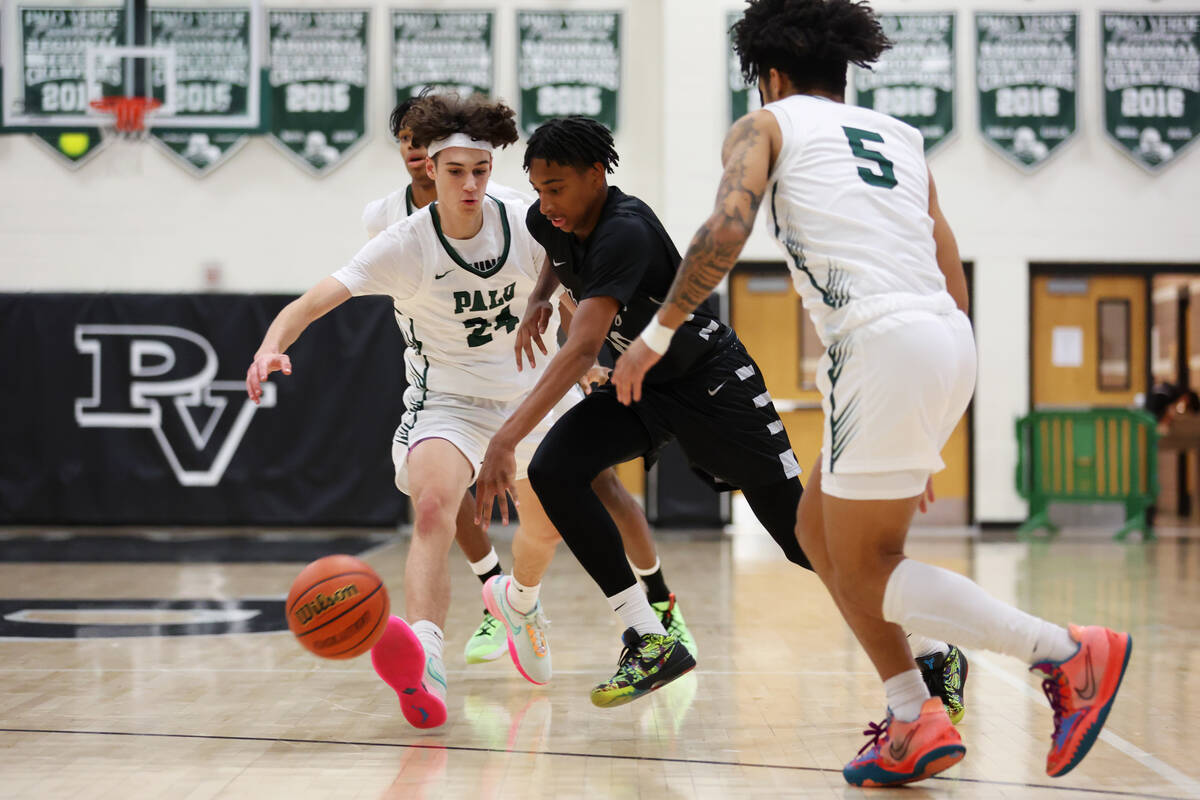 Shadow Ridge's Jalen Butler (10) dribbles the ball under pressure from Palo Verde's Mason Abitt ...