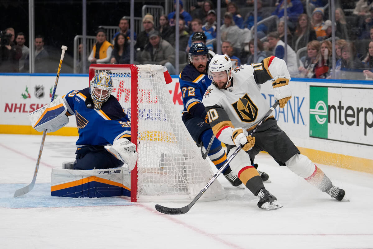 Vegas Golden Knights' Nicolas Roy (10) handles the puck as St. Louis Blues goaltender Jordan Bi ...