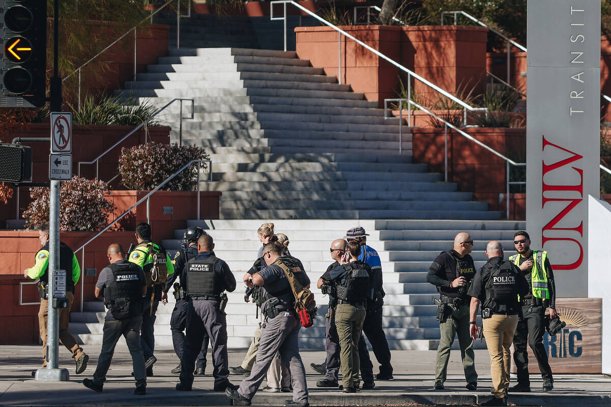 Police are seen at the scene of a shooting on the UNLV campus on Wednesday, Dec. 6, 2023, in La ...