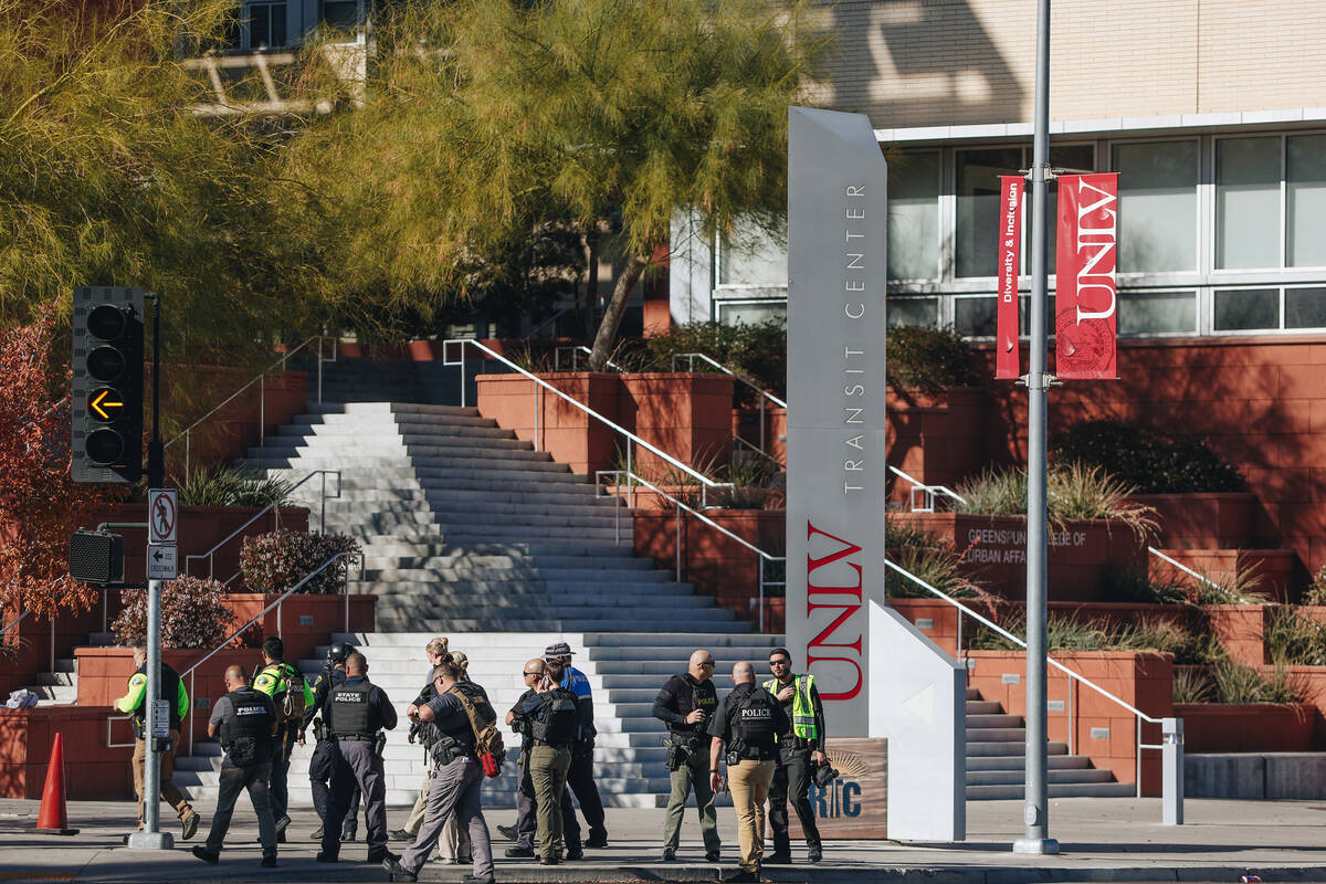 Police are seen at the scene of a shooting on the UNLV campus on Wednesday, Dec. 6, 2023, in La ...