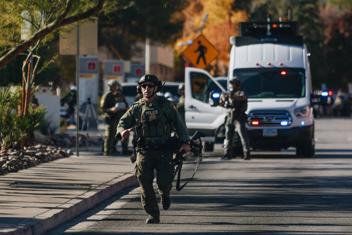 Police are seen at the scene of a shooting on the UNLV campus on Wednesday, Dec. 6, 2023, in La ...