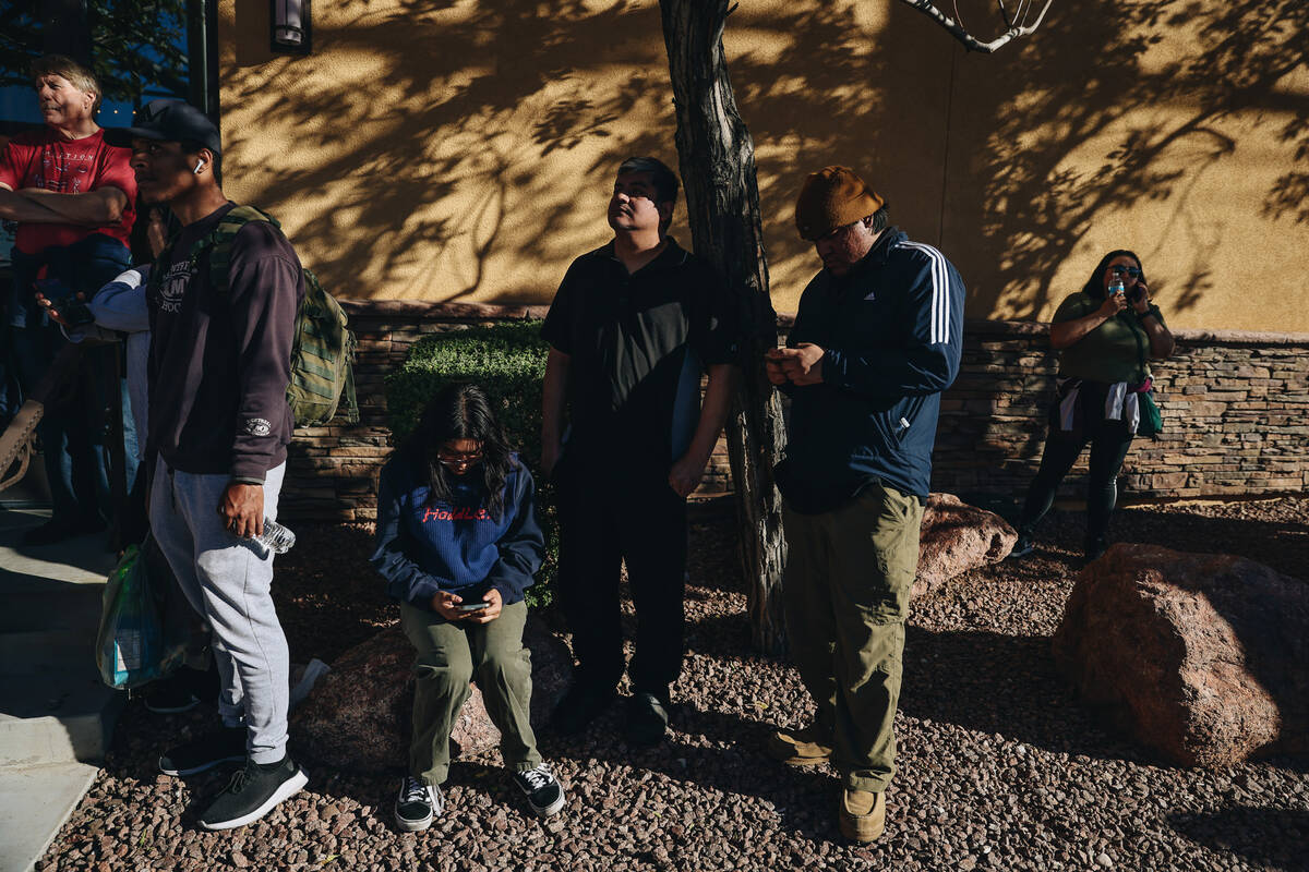 People wait for students at the scene of a shooting on the UNLV campus on Wednesday, Dec. 6, 20 ...