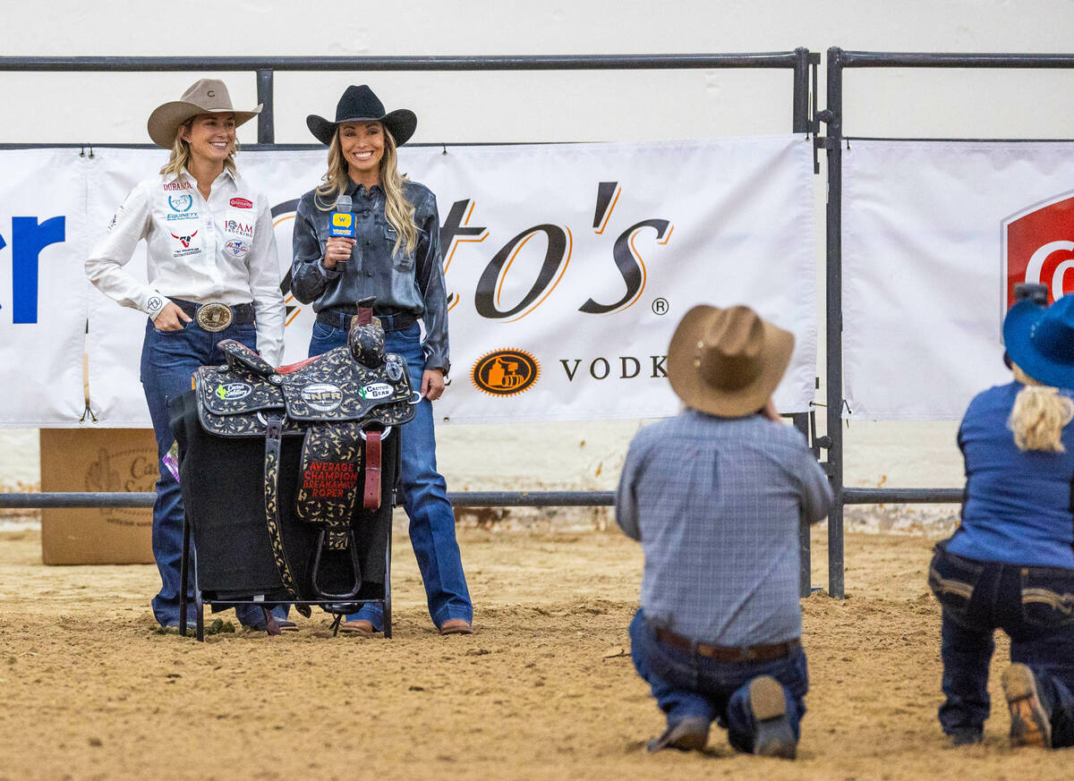 Cheyanne McCartney of Kingston, OK., wins a saddle as the average champion during the NFR break ...