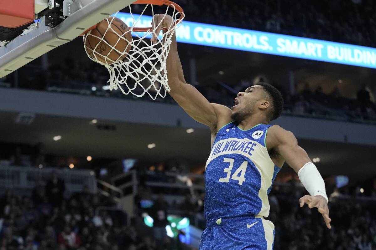 Milwaukee Bucks' Giannis Antetokounmpo dunks during the second half of an NBA basketball game a ...