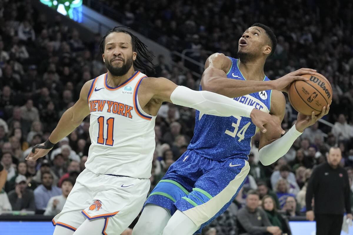 Milwaukee Bucks' Giannis Antetokounmpo drives past New York Knicks' Jalen Brunson during the se ...