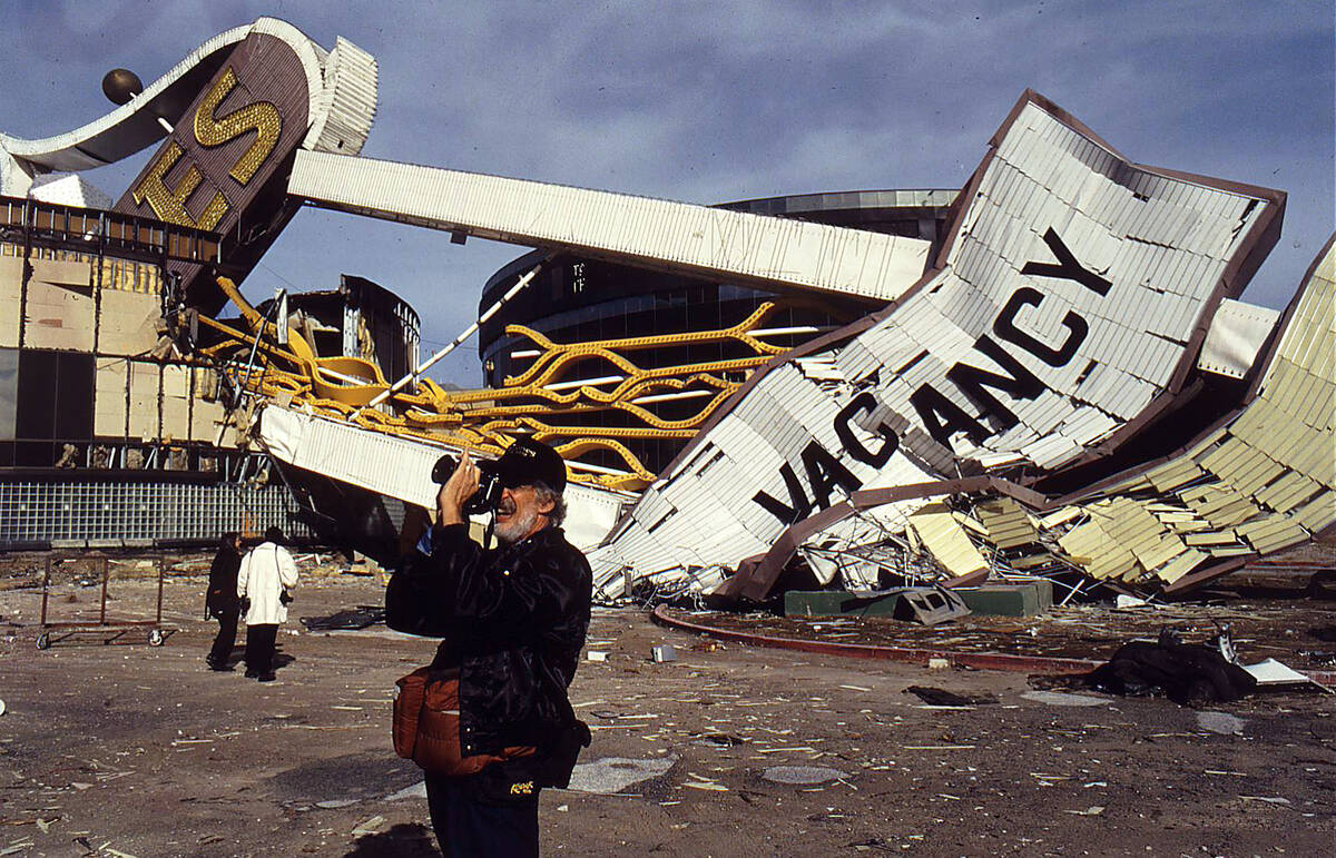 A photographer takes a photo at the site of the recently imploded Dunes Hotel-Casino, Oct. 29, ...