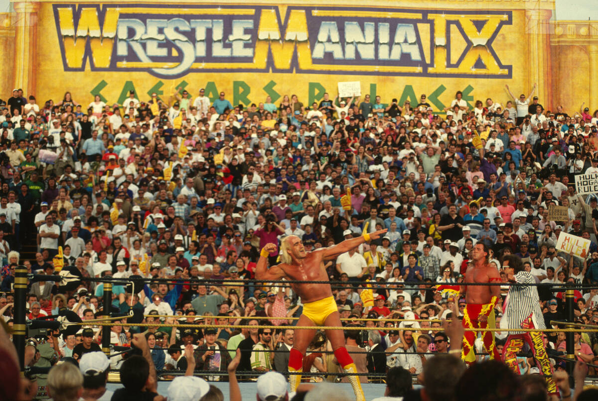 Hulk Hogan poses in the ring with Brutus "The Barber" Beefcake and Jimmy Hart outside Caesars P ...
