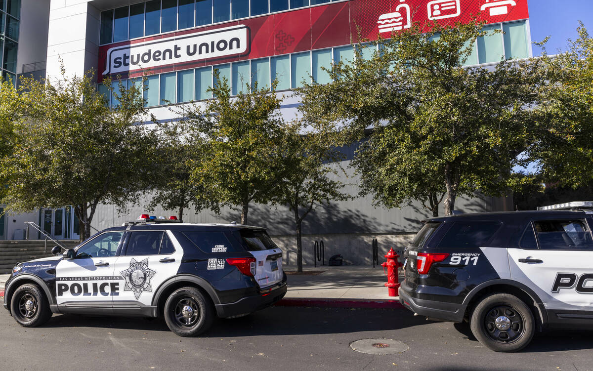 Metro vehicles still line the parking lot outside for the Student Union following the shooting ...