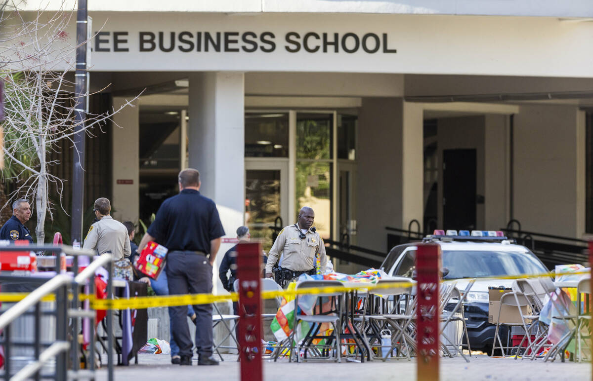 Metro officers and others work about the courtyard between the Lee Business School and Student ...