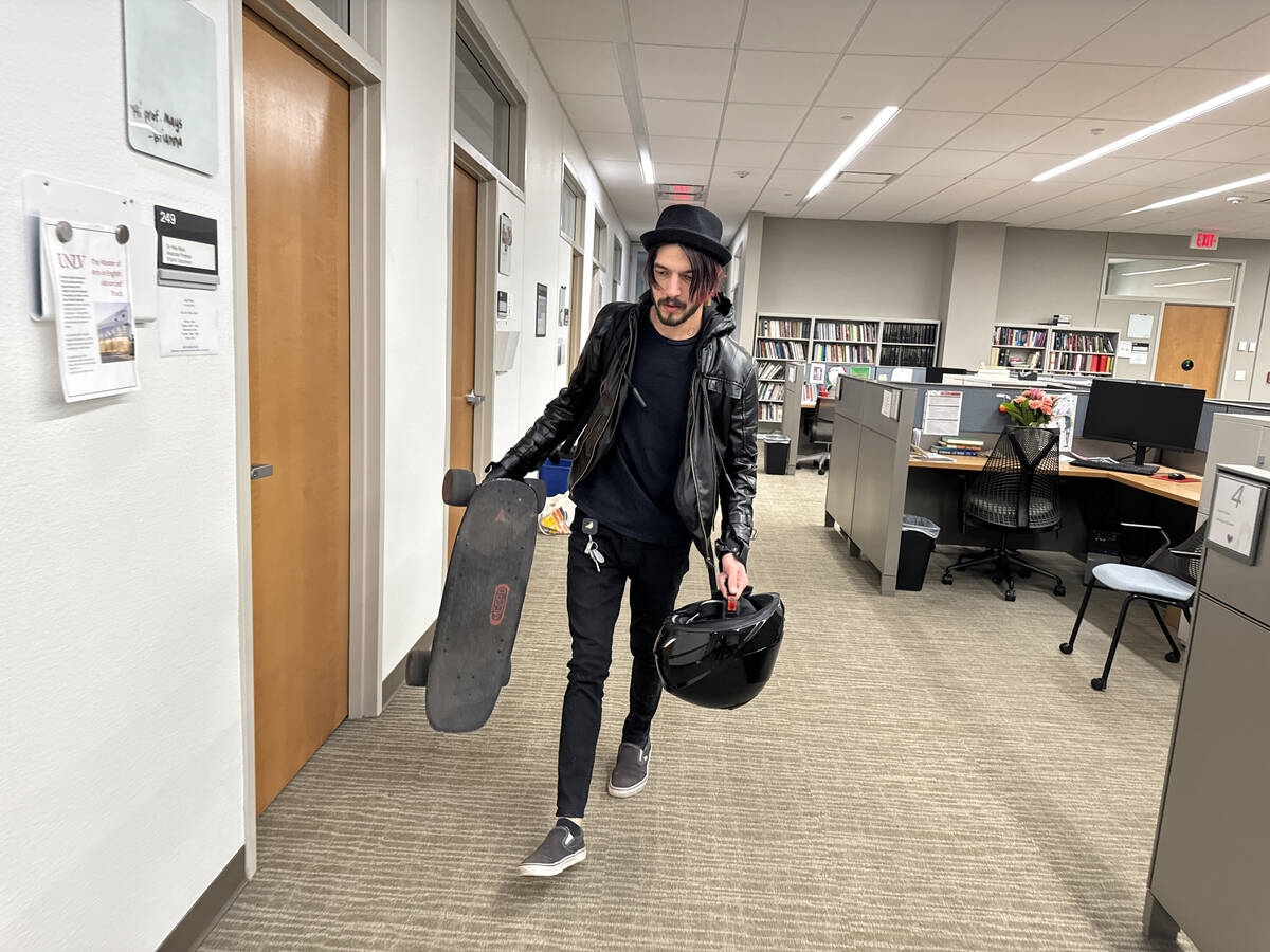 Staff member Gregory Galindo retrieves personal items left behind by friends on the UNLV campus ...