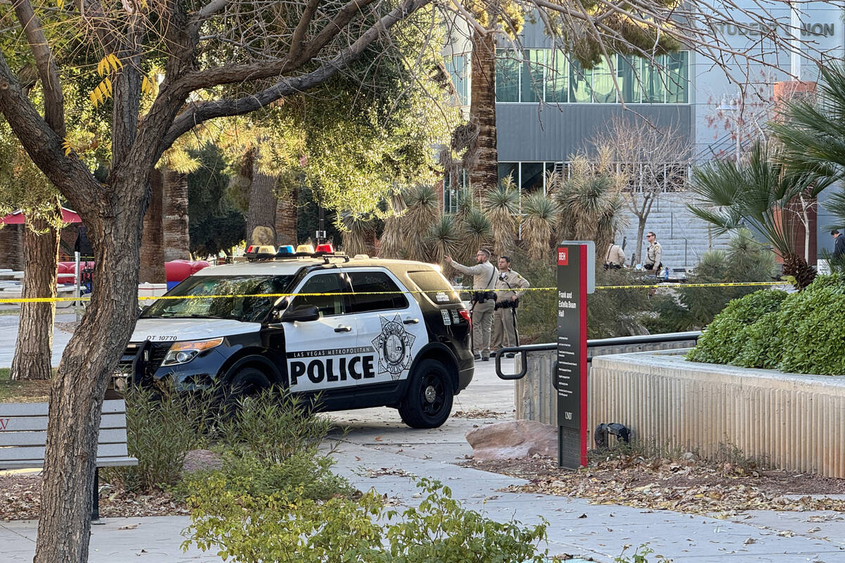 Police investigate between the Student Union and Beam Hall on the UNLV campus in Las Vegas Thur ...