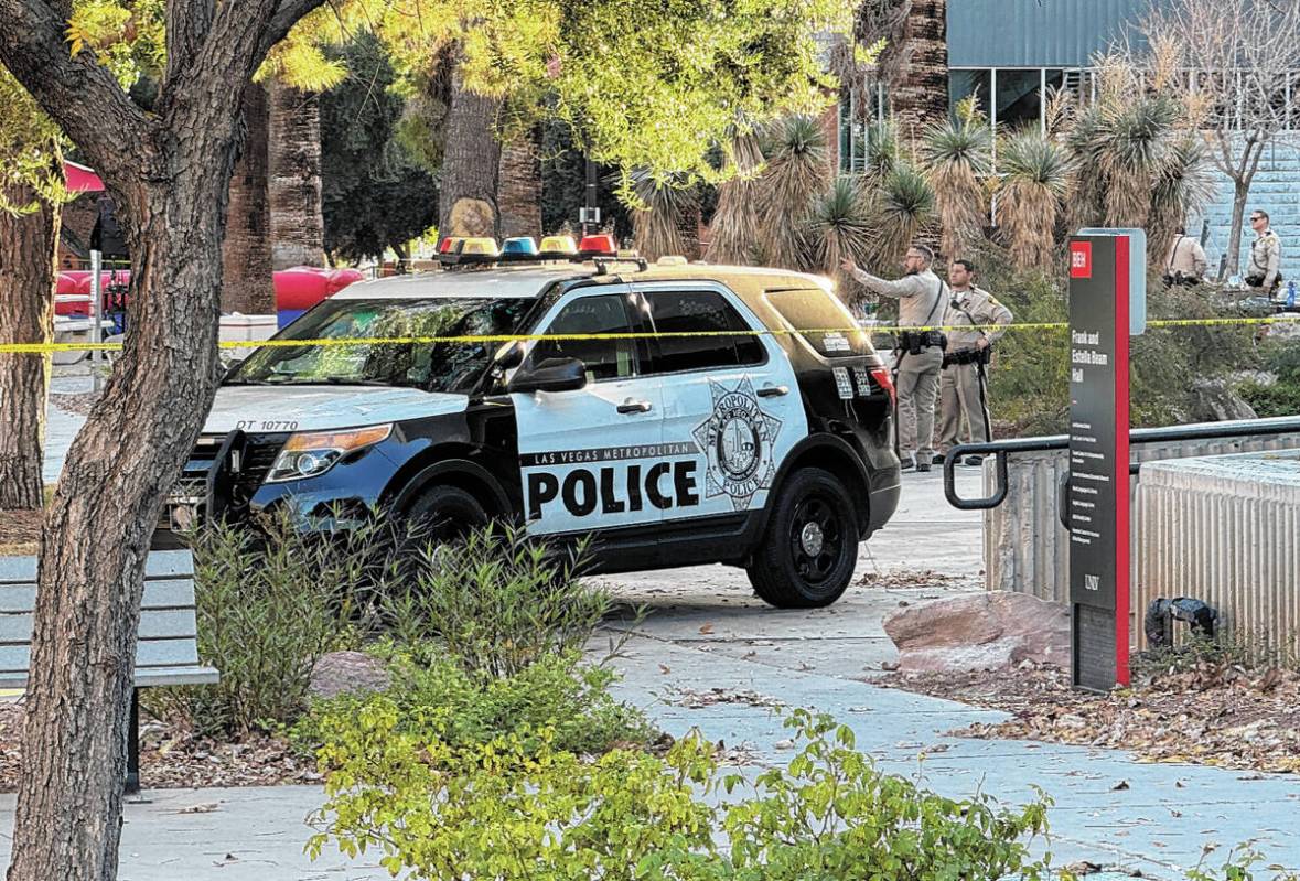 Police investigate between the Student Union and Beam Hall on the UNLV campus in Las Vegas Thur ...