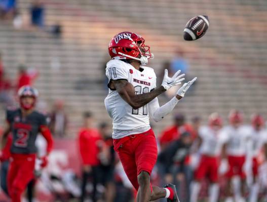 UNLV's Ricky White makes a touchdown reception against New Mexico during the third quarter of a ...