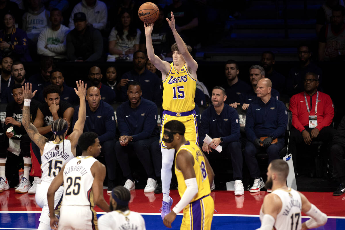 Los Angeles Lakers guard Austin Reaves (15) shoots against New Orleans Pelicans guard Jose Alva ...