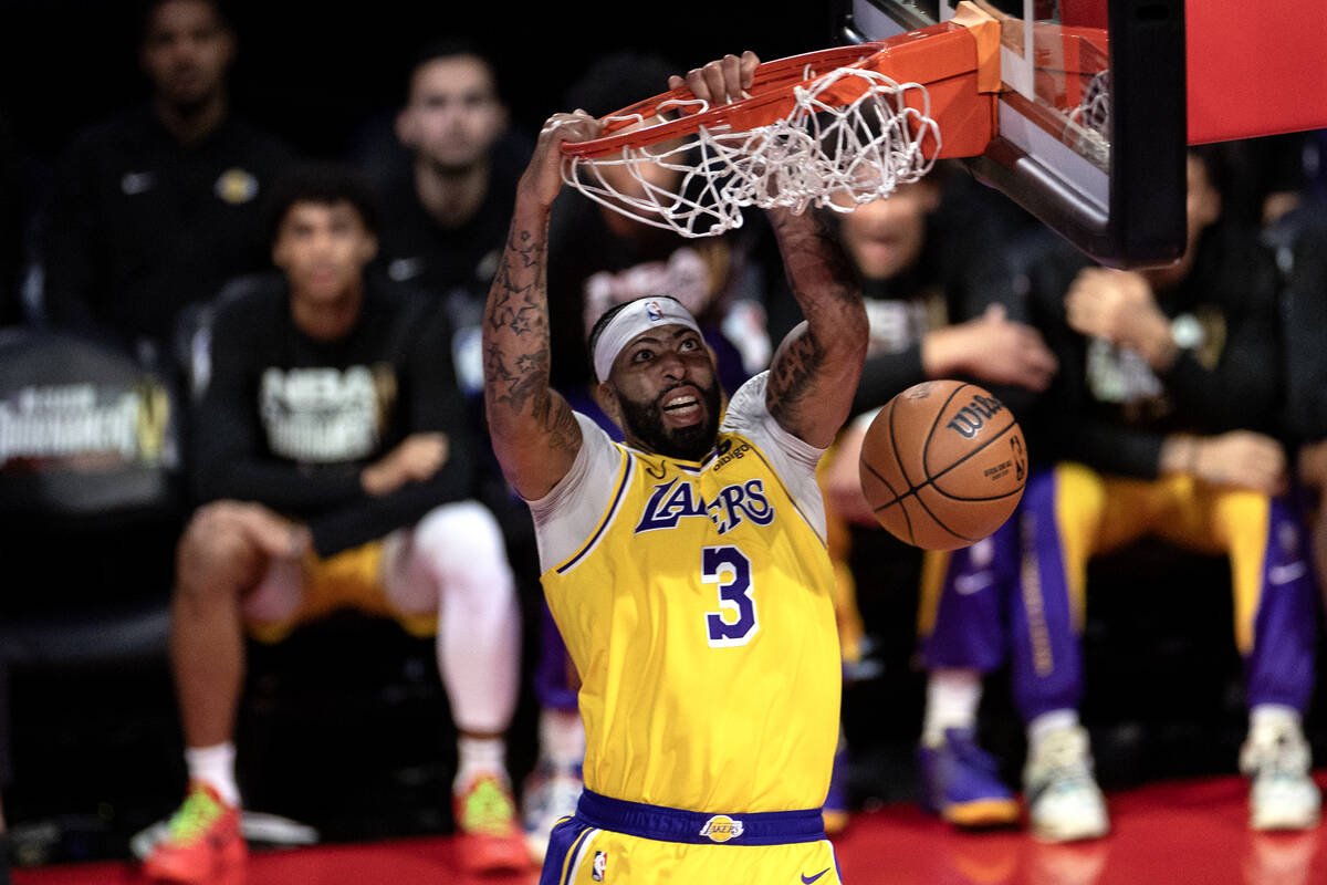 Los Angeles Lakers forward Anthony Davis (3) dunks during the second half of an NBA In-Season T ...